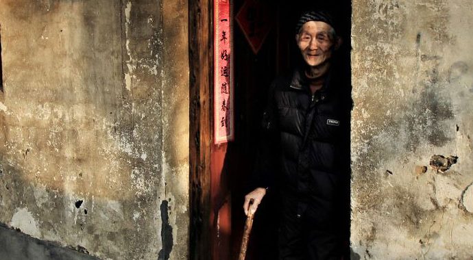 Elderly man in doorway