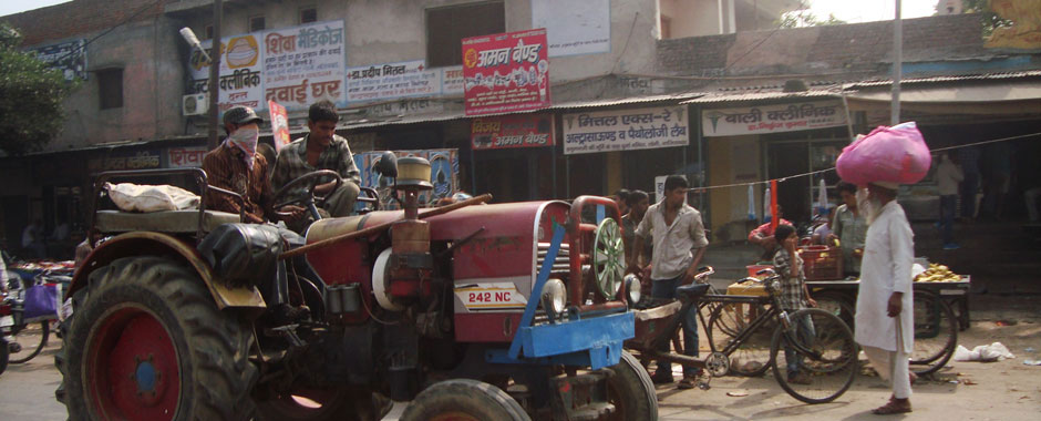Farmers driving through the village of Karhera in India