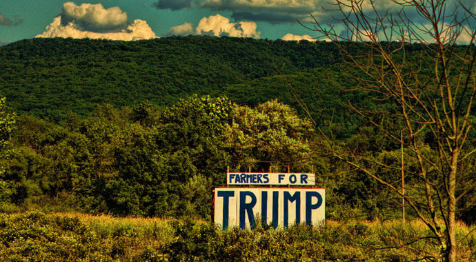 Sign in rural landscape which reads 'Farmers for Trump'
