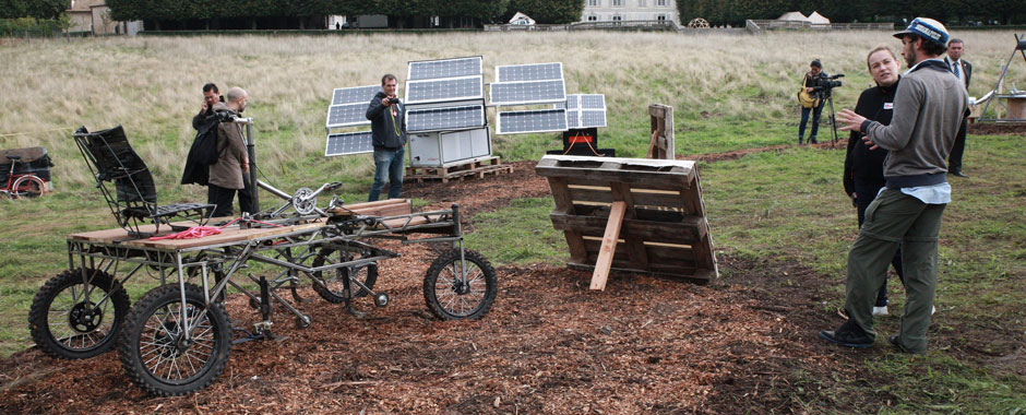 Outdoor exhibition with prototype pedal tractor and solar panels