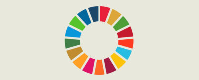 Round icon with colours representing the Sustainable Development Goals