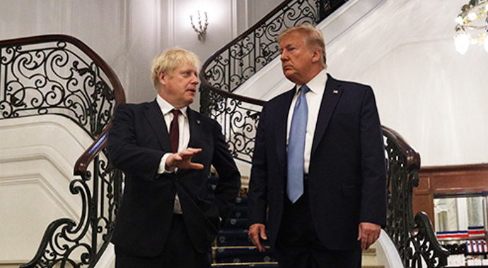 Boris Johnson and Donald Trump standing on a staircase together