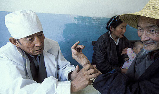 Elderly man being treated